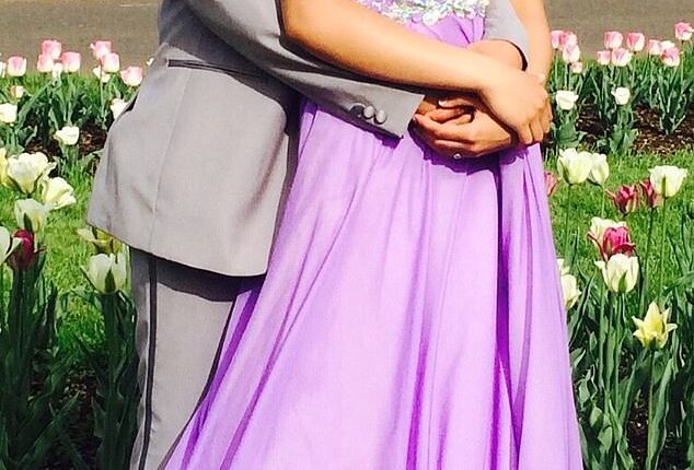 Naisha Ruzensky and Jayden Johnson pose together at prom before Johnson's transition. The two started dating in high school
