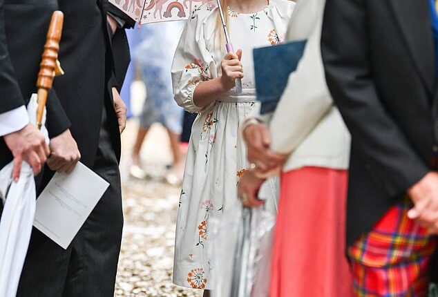Lena Tindall retained her title of most playful royal at Peter Phillips and Harriet Sperling's royal wedding today, as she joyfully played in the rain while clutching a unicorn umbrella