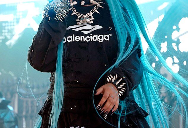 North West, 12, takes the stage in spiked choker and blue pigtails at VERY rowdy music festival… as she gets dad Kanye's stamp of approval
