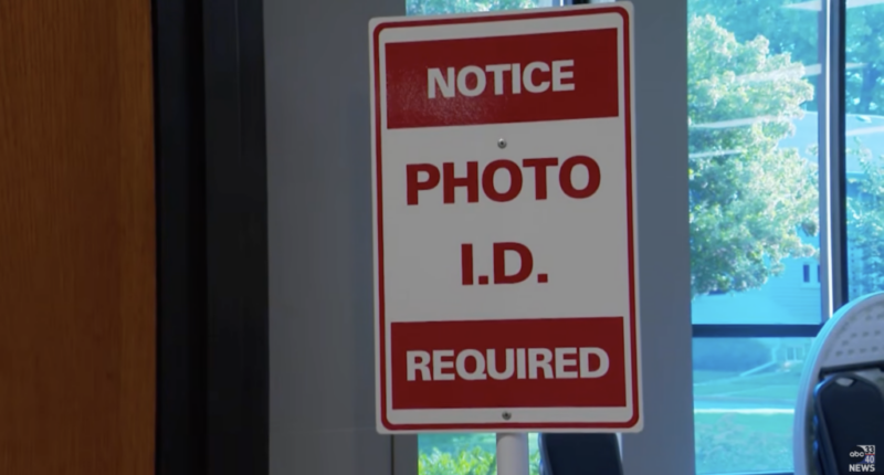 A sign noting Photo ID requirements at a polling place.