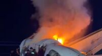 Footage shared online then showed the small aircraft laying upside down with flames bursting out its underbelly, sending smoke billowing through the air, as rescuers tried to break open the windshield
