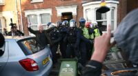 Police officers appear to be attacked by demonstrators near Portswood Police Station, following a protest in Southampton tonight