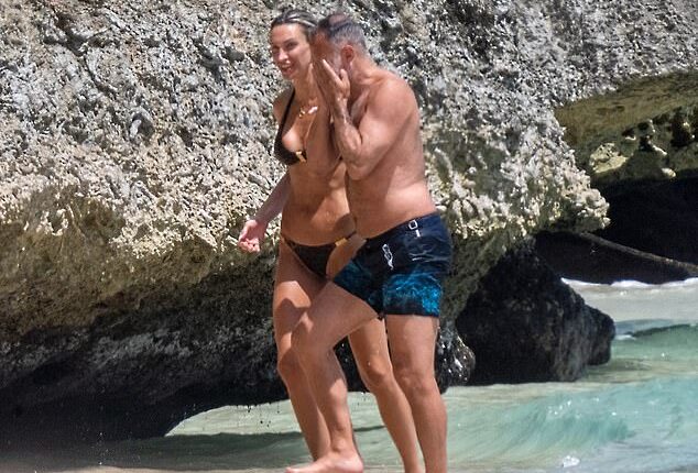 Ryan Giggs, 52, has been snapped soaking in the Caribbean sunshine with his 38-year-old girlfriend Zara Charles