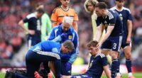 BIlly Gilmour goes down injured during Saturday's win over Curacao