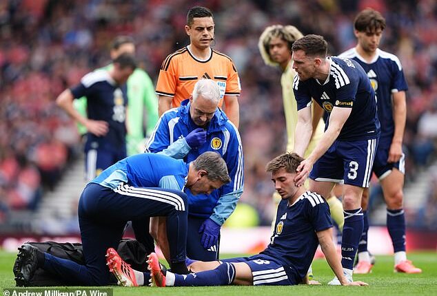BIlly Gilmour goes down injured during Saturday's win over Curacao