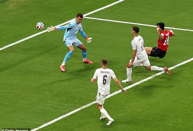 Oh Hyeon-gu (right) scores the late winner for South Korea in their World Cup opener