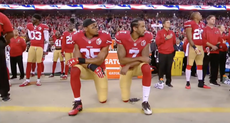 Colin Kaepernick kneels during National Anthem