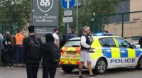 Large crowds of pupils and parents gathered at the scene after three people were injured in a stabbing