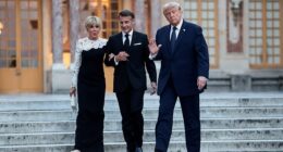 President Donald Trump (right) waves as he arrives at the Palace of Versailles to have dinner with French President Emmanuel Macron (center) and his wife Brigitte Macron (left)