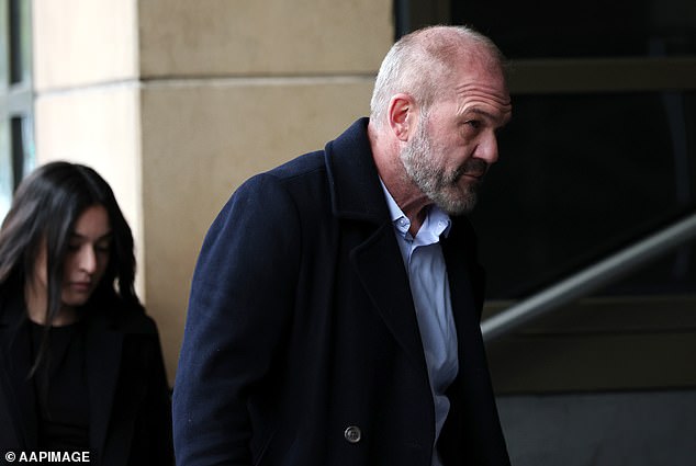 Abraham Abbas enters Melbourne Magistrates' Court on Friday