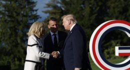 Donald Trump shook French First Lady Brigitte Macron's hand for about 14 seconds as French President Emmanuel Macron looked on, overshadowed by the US President