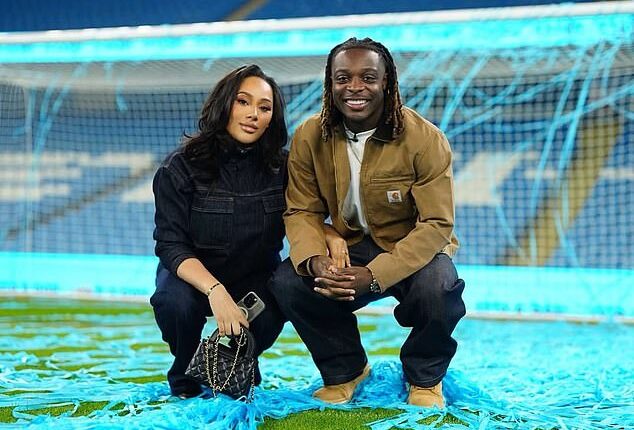 Belgium winger Jeremy Doku has come under fire for saying that he intends to leave the World Cup to attend the birth of his first child (Doku pictured with wife Shireen)