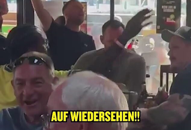 England fans mocked Germany's exit as they geared up for their clash with DR Congo in Atlanta - in this picture they were signing 'Auf Wiedersehen!' after they lost to Paraguay on penalties