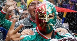 Mexico City will play host to England fans for the last-16 clash with one of the host nations - pictured is a man in a traditional Mexican wrestling mask after their win over Ecuador