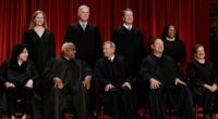 The Supreme Court justices are seen posing for a group portrait. Justices sided with the Trump administration 6-3 on two major immigration and asylum cases