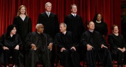 The Supreme Court justices are seen posing for a group portrait. Justices sided with the Trump administration 6-3 on two major immigration and asylum cases