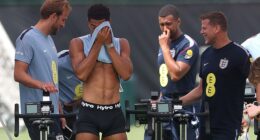 England star Jude Bellingham wipes his face during a training session while stripped down to his underpants on Thursday