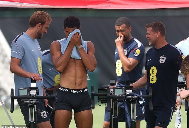 England star Jude Bellingham wipes his face during a training session while stripped down to his underpants on Thursday