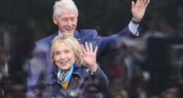 Former President Bill Clinton, behind, and former Secretary of State Hillary Clinton arrive on stage during the dedication ceremony for the Obama Presidential Center, June 18
