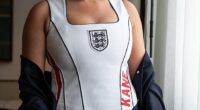 Kate Kane stunned in a white custom halter neck football shirt embossed with her husband Harry's surname in red lettering