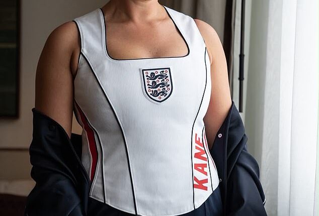 Kate Kane stunned in a white custom halter neck football shirt embossed with her husband Harry's surname in red lettering
