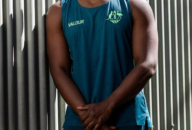 The company supplying Australia's Commonwealth Games uniforms has pulled promotional pictures of model George Mensah (above), who is accused of stealing more than $600,000 from an elderly man who suffers from dementia