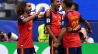 Spain's players Marc Cucurella and Rodri celebrate with goalscorer Mikel Oyarzabal