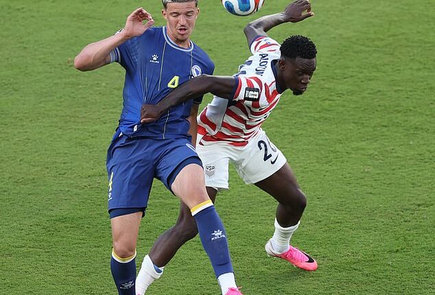 There are more actual fouls committed during the average corner-kick match than there were on Folarin Balogun's challenge against Bosnia and Herzegovina player Tarik Muharemovic (left) in California on July 1