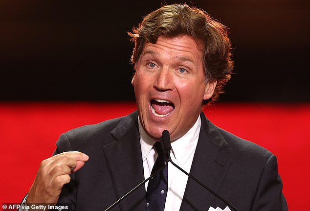 Carlson speaks during the public memorial service for conservative activist Charlie Kirk last September