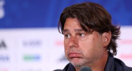 Mauricio Pochettino sighs as he addresses the media after his team's brutal 4-1 World Cup loss