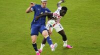 Folarin Balogun (20) fouls Bosnia's Tarik Muharemovic (4), resulting in a red card